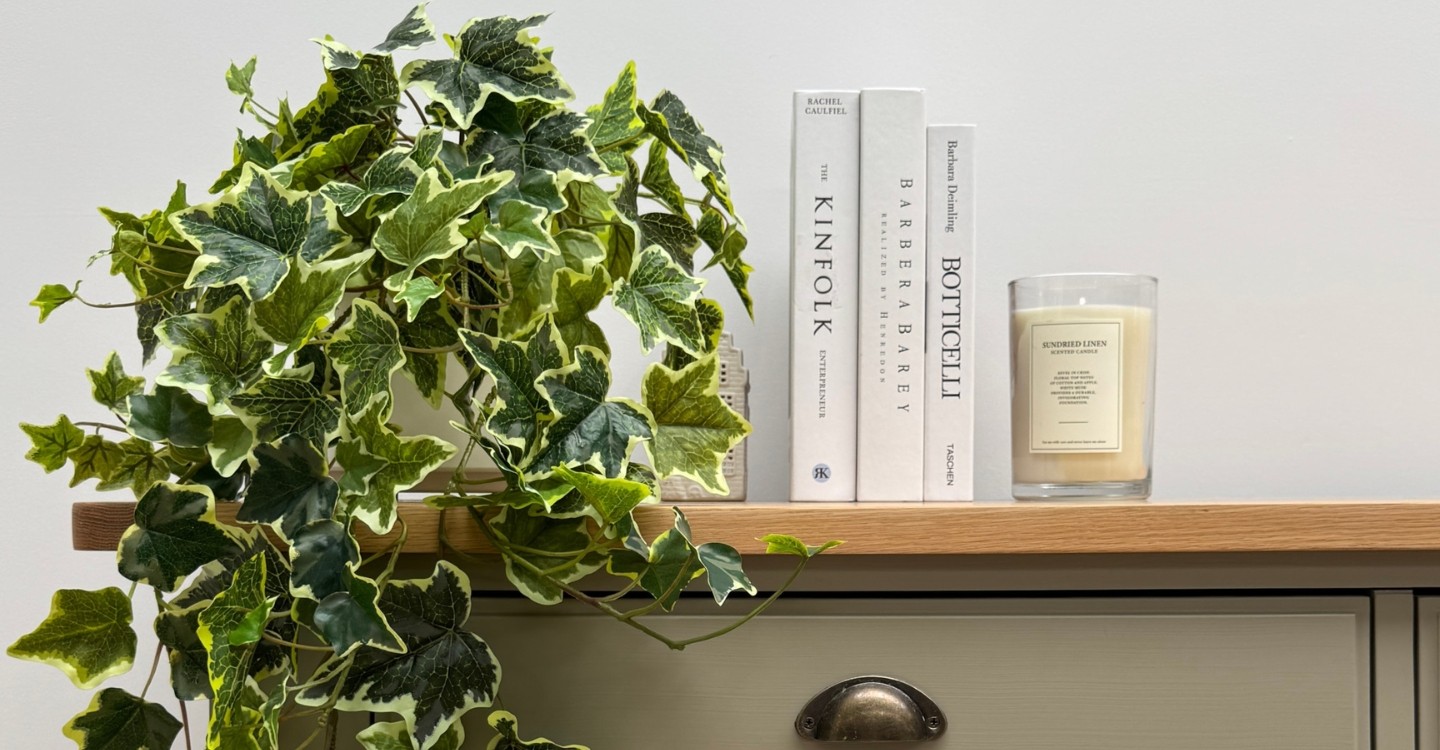 artificial plants on a bookshelf